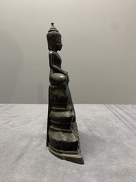 A Laotian bronze figure of a seated Buddha, 19th C.