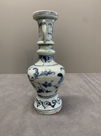 A pair of Chinese blue and white handled vases with floral design, Ming