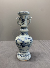A pair of Chinese blue and white handled vases with floral design, Ming