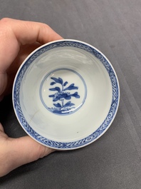 Five Chinese caf&eacute;-au-lait-ground blue and white cups and four saucers, conical shell mark, Kangxi