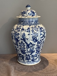 A Chinese blue and white vase and cover with landscapes and flowers, Kangxi