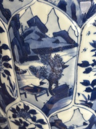 A Chinese blue and white vase and cover with landscapes and flowers, Kangxi