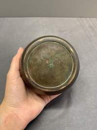 A rare Chinese bronze 'sage in a mountainous landscape' handwarmer, 17/18th C.