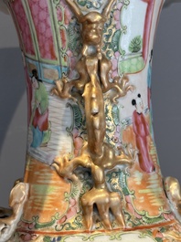 A pair of Chinese Canton famille rose vases with narrative design, 19th C.