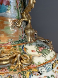 A pair of Chinese Canton famille rose vases with narrative design, 19th C.