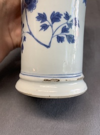 A pair of Chinese blue and white beaker vases with floral sprigs, Transitional period