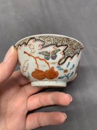 Three Chinese famille rose 'flowers and butterflies' cups and saucers, Yongzheng