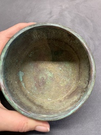 A rare Chinese bronze 'sage in a mountainous landscape' handwarmer, 17/18th C.