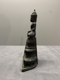 A Laotian bronze figure of a seated Buddha, 19th C.