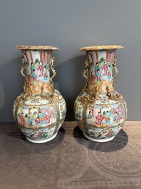A pair of Chinese Canton famille rose vases with narrative design, 19th C.