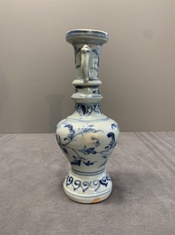 A pair of Chinese blue and white handled vases with floral design, Ming