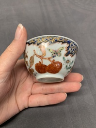 Three Chinese famille rose 'flowers and butterflies' cups and saucers, Yongzheng