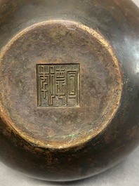 A Chinese bronze water pot with 'Taotie' handles, Xuande mark, 17/18th C.