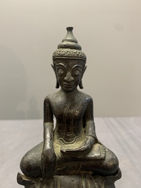 A Laotian bronze figure of a seated Buddha, 19th C.