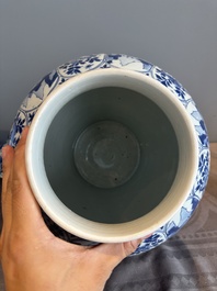 A Chinese blue and white vase and cover with landscapes and flowers, Kangxi