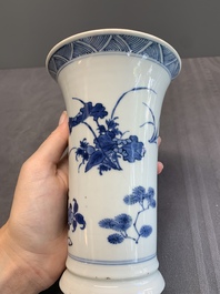 A pair of Chinese blue and white beaker vases with floral sprigs, Transitional period