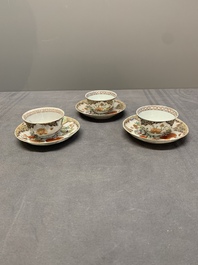 Three Chinese famille rose 'flowers and butterflies' cups and saucers, Yongzheng