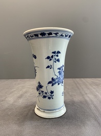A pair of Chinese blue and white beaker vases with floral sprigs, Transitional period