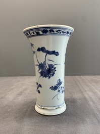 A pair of Chinese blue and white beaker vases with floral sprigs, Transitional period