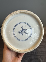 A Chinese blue and white vase and cover with landscapes and flowers, Kangxi