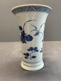 A pair of Chinese blue and white beaker vases with floral sprigs, Transitional period