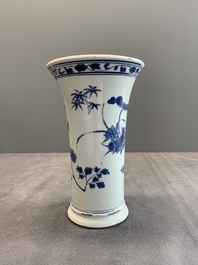A pair of Chinese blue and white beaker vases with floral sprigs, Transitional period