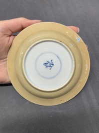 Five Chinese caf&eacute;-au-lait-ground blue and white cups and four saucers, conical shell mark, Kangxi