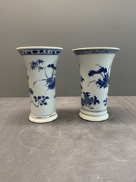 A pair of Chinese blue and white beaker vases with floral sprigs, Transitional period