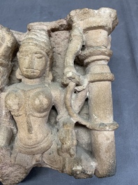 An Indian architectural red sandstone fragment with divinities, 13th C.