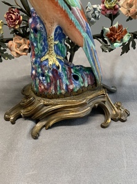 A pair of candle holders mounted with Chinese famille rose models of pheasants, Qianlong