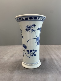 A pair of Chinese blue and white beaker vases with floral sprigs, Transitional period