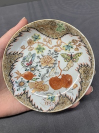 Three Chinese famille rose 'flowers and butterflies' cups and saucers, Yongzheng