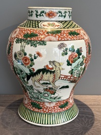A Chinese famille verte 'mythical animal' vase and two Canton famille rose vases, 19th C.