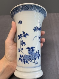 A pair of Chinese blue and white beaker vases with floral sprigs, Transitional period