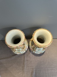 A pair of Chinese Canton famille rose vases with narrative design, 19th C.