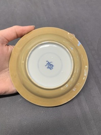 Five Chinese caf&eacute;-au-lait-ground blue and white cups and four saucers, conical shell mark, Kangxi