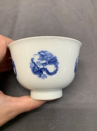A Chinese blue and white 'dragon' cup, Kangxi mark, 19/20th C.