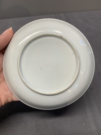 A Chinese export famille rose cup and saucer with a herring merchant, Qianlong