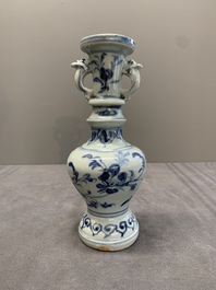 A pair of Chinese blue and white handled vases with floral design, Ming