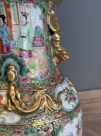 A Chinese famille verte 'mythical animal' vase and two Canton famille rose vases, 19th C.