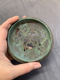 A rare Chinese bronze 'sage in a mountainous landscape' handwarmer, 17/18th C.