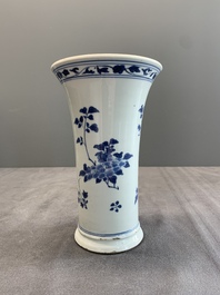 A pair of Chinese blue and white beaker vases with floral sprigs, Transitional period