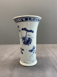 A pair of Chinese blue and white beaker vases with floral sprigs, Transitional period