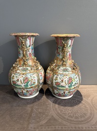 A pair of Chinese Canton famille rose vases with narrative design, 19th C.
