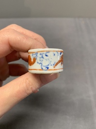 A collection of nine Chinese blue and white, monochrome and famille rose bird feeders, 19th C.