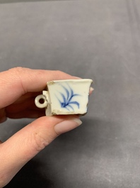 A collection of nine Chinese blue and white, monochrome and famille rose bird feeders, 19th C.
