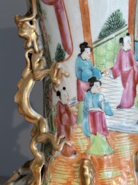 A pair of Chinese Canton famille rose vases with narrative design, 19th C.
