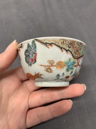Three Chinese famille rose 'flowers and butterflies' cups and saucers, Yongzheng