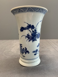 A pair of Chinese blue and white beaker vases with floral sprigs, Transitional period