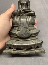 A Laotian bronze figure of a seated Buddha, 19th C.